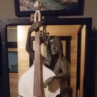 woman with cello by Edward Kitt - search and link Sculpture with SculptSite.com
