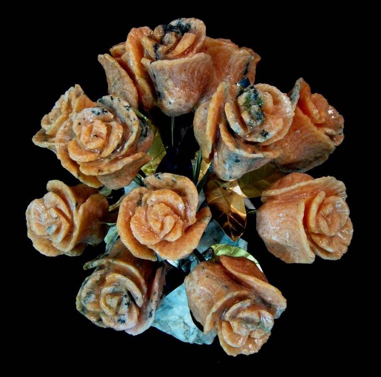 One Dozen Salmon Colored Marble Stone Roses by John Foster - search and link Sculpture with SculptSite.com